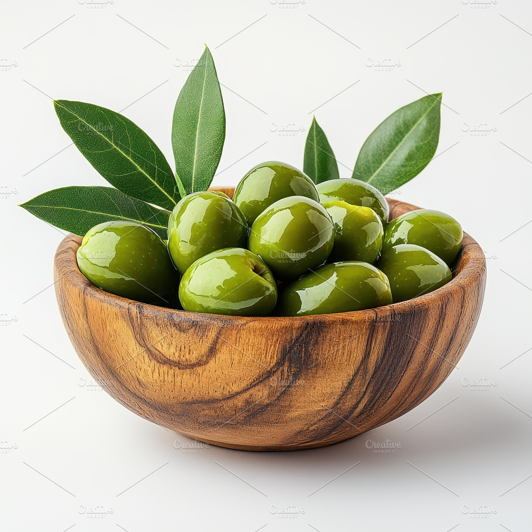Green olives in wooden bowl with lea, a Food & Drink Photo by Pixeness Studio