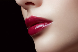 Woman's lips wearing vibrant red gloss. Modern beauty and fashio, a Beauty & Fashion Photo by Studio ANNA