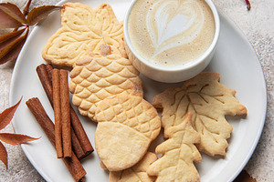 Autumn cookies and coffee with cinnamon sticks, a Food & Drink Photo by Olena Rudo