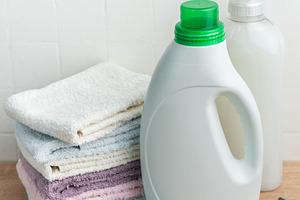 Laundry supplies and folded towels for household chores