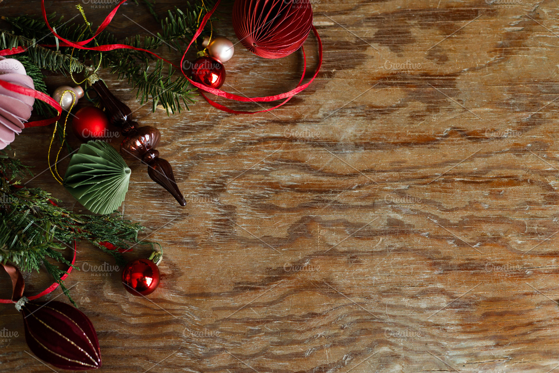 Christmas border. Festive side border of paper ornaments, glass, a Photo by Sonjachni