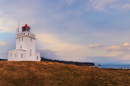 Picturesque autumn evening view to Dyrholaey lighthouse and Reyn, an Architecture Photo by YuriyB