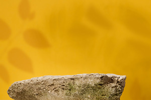 Stones on yellow background, stage for advertising and product d, a Background Photo by ndanko