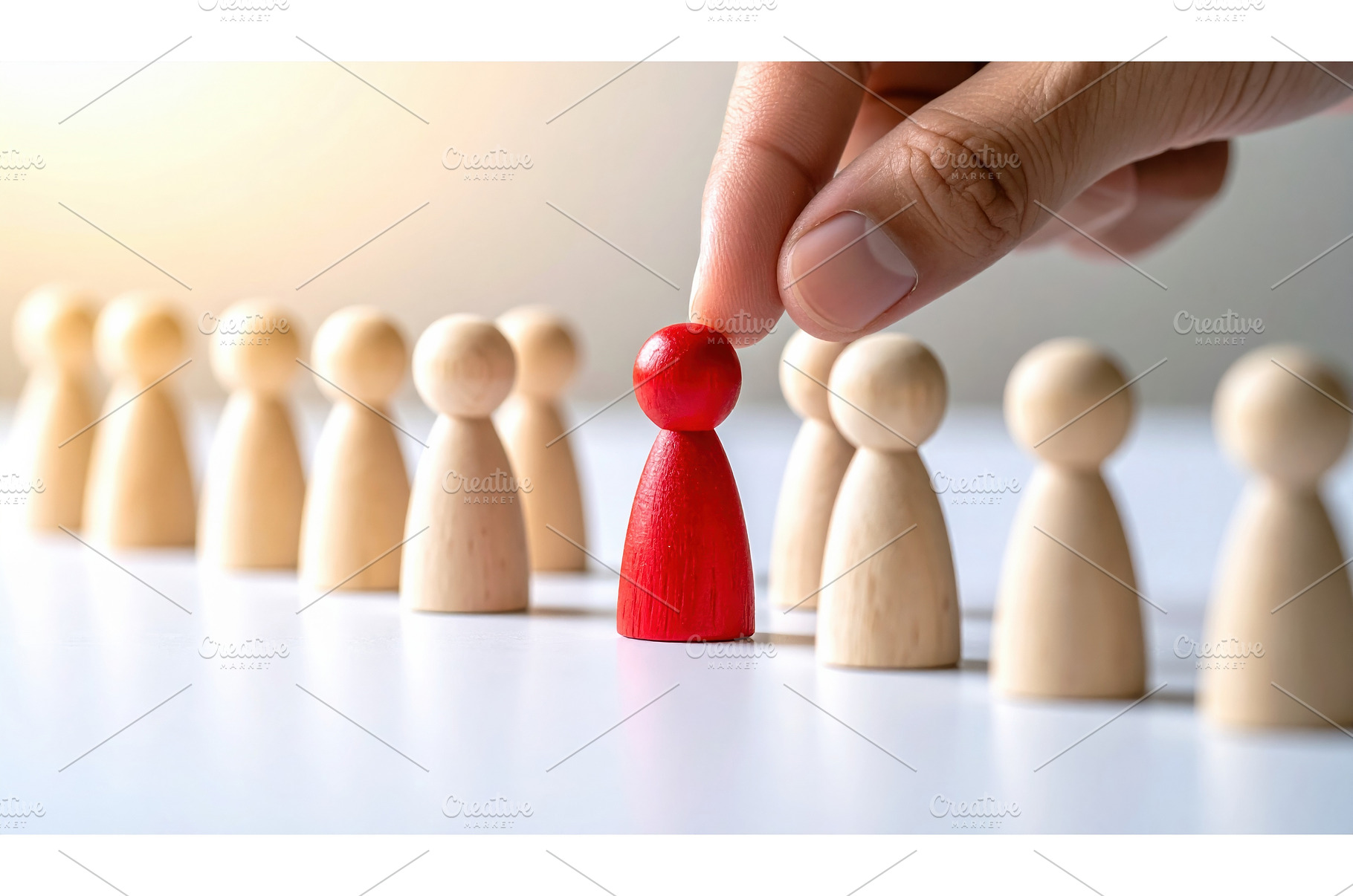 Red pawn being selected among beige, a Business Photo by Igor Tichonow