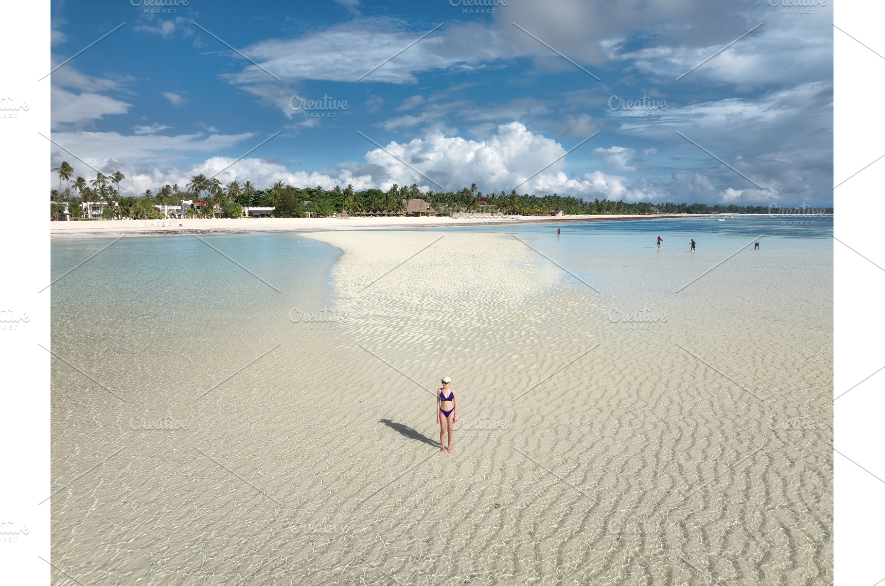 Woman in bikini stands on a white, a Person Photo by den-belitsky