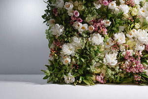 Green flower wall with pink and white blossoms providing a lush, a Photo by Studio ANNA