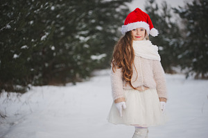 Little happy beautiful girl in stock photo containing winter and snow