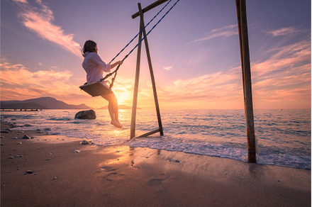 Happy young woman on wooden swing in, a Person Photo by den-belitsky