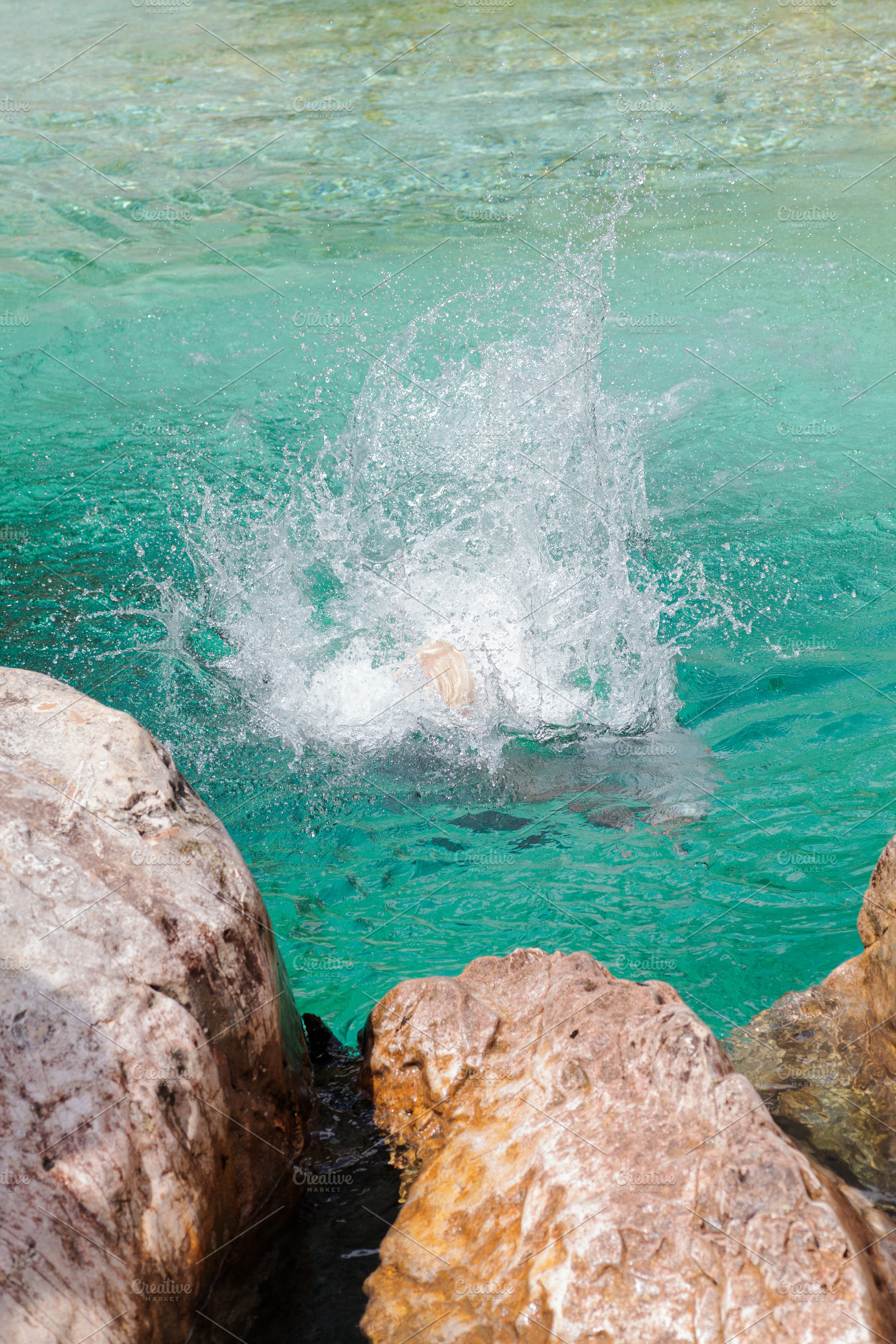 Splashing water, jumping into cold mountain river in deep gorge., a Nature Photo by Bepslabor