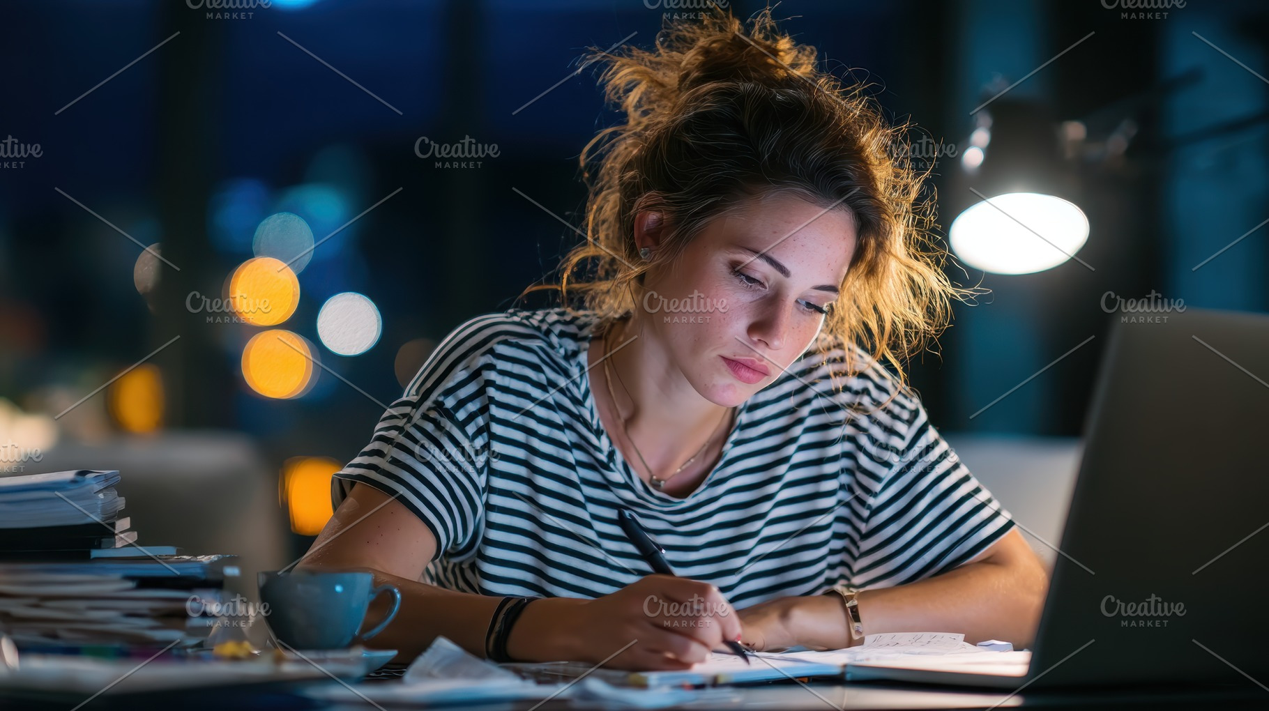 Young woman studying late at night w, a Photo by Pixeness Studio