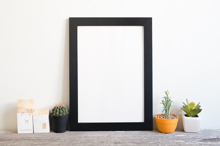 Blank frame poster on wall containing frame, mockup, and wall, a Business Photo by ptystockphoto