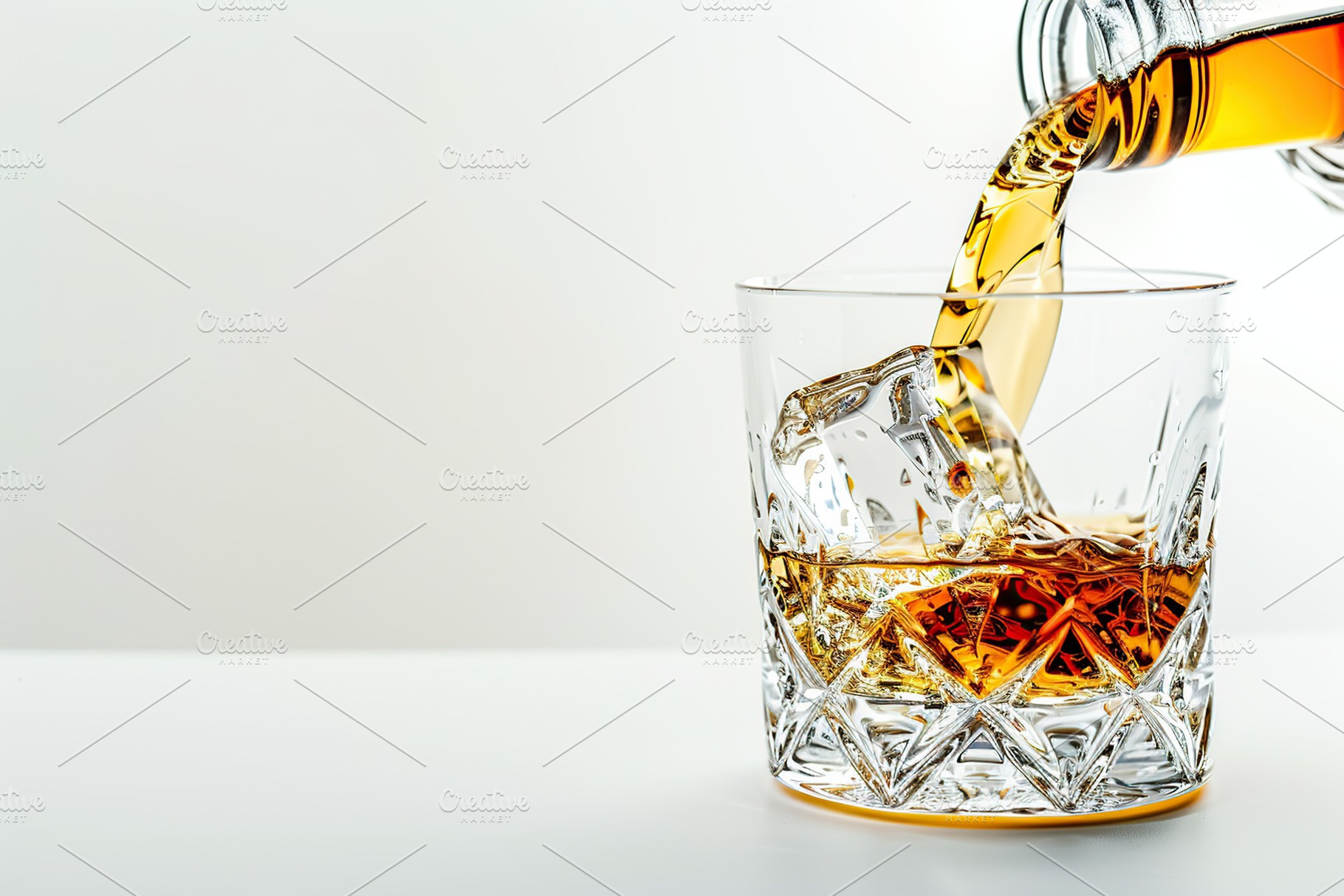 Pouring scotch whiskey from bottle into glass, a Food & Drink Photo by AlyaAnd