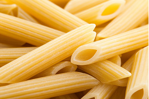 Close up of uncooked penne pasta, a Food & Drink Photo by Lermont51