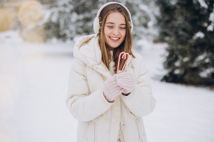 A cute girl holds candy canes, a Holiday Photo by Cherkas Photography