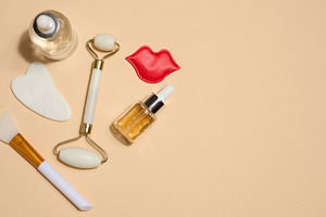 Set of cosmetics and skin care tools including facial massagers,, a Health & Medical Photo by ndanko