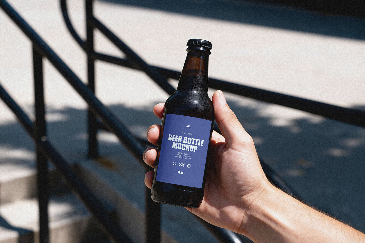 Amber Beer Bottle in Hand Mockup, a Product Mockup by Design Squad (Photo 1 of 4)
