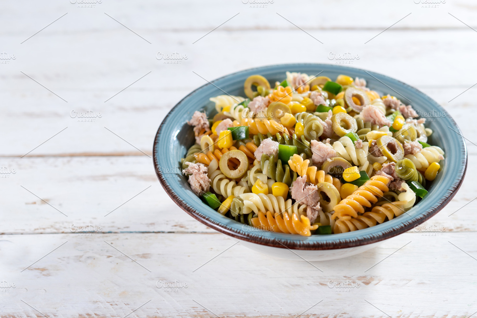 Pasta salad with tuna, corn and olives in bowl, a Food & Drink Photo by etorres69