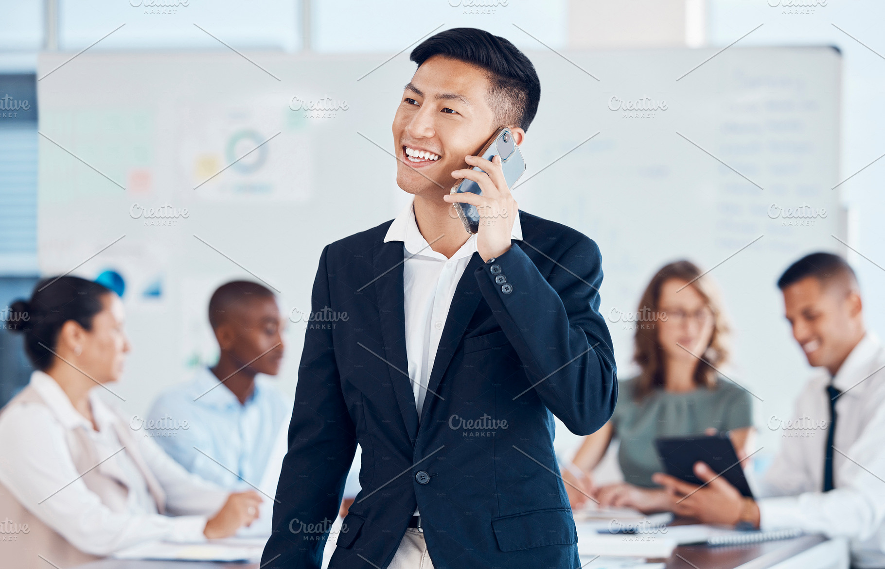 Businessman, phone call and networking with communication, conversation and meeting with workers in office. Asian man, ceo and leader in workshop, talking and mobile smartphone at group work seminar, a Photo by Peopleimages.com