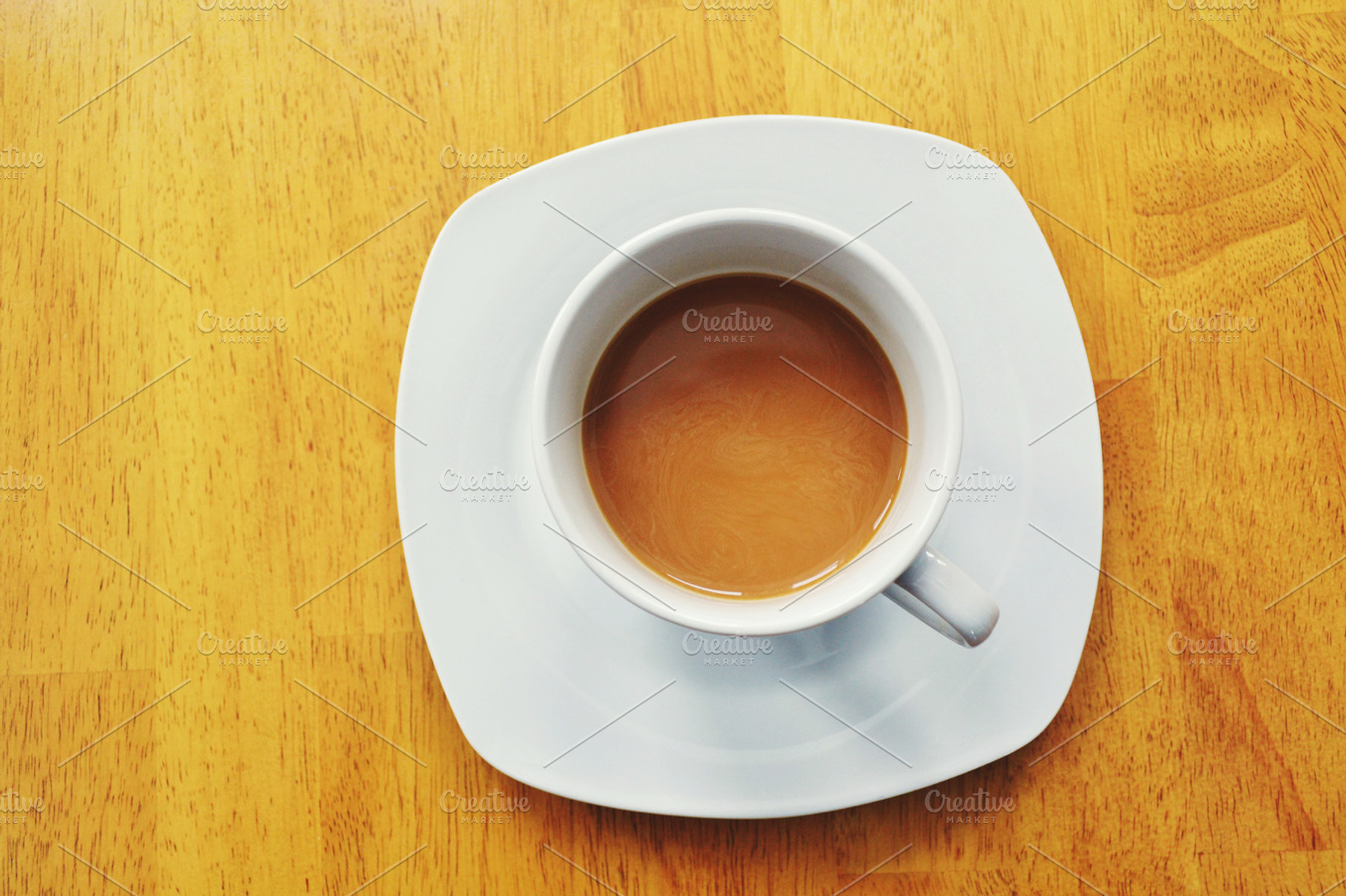 Coffee cup featuring coffee, cup, and wooden