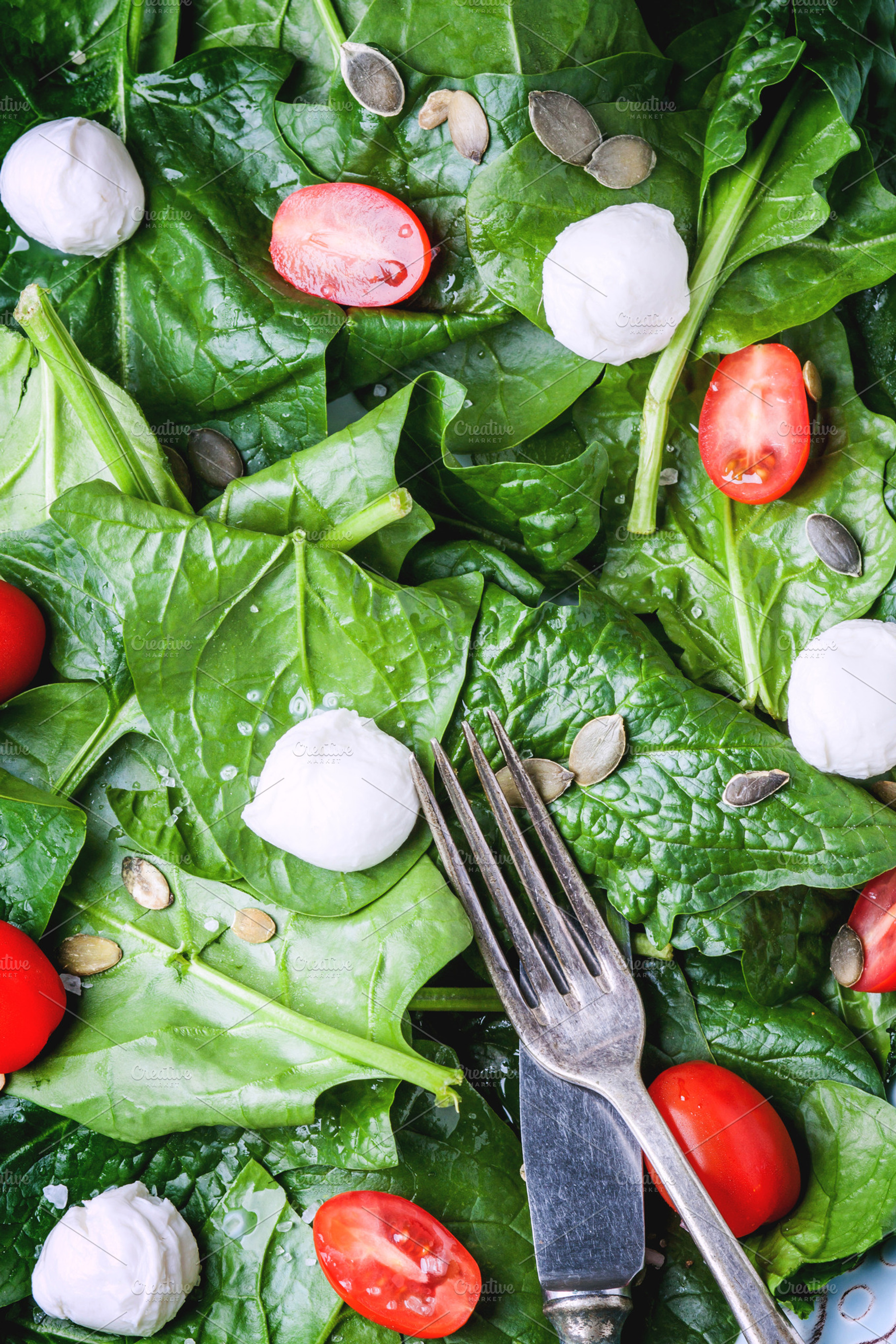 Salad from spinach tomatoes and mozzarella featuring spinach, salad, and