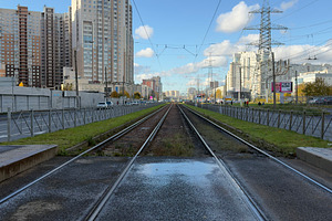 A view of railway tracks stretching into the distance, flanked by modern buildi, an Industrial Photo by Textures & Backgrounds