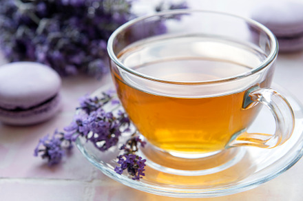Cup of tea with macaroon dessert with lavender flavor, a Food & Drink Photo by Olena Rudo