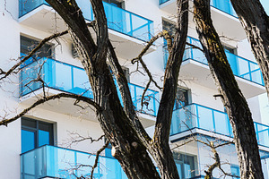 Residential balconies and trees, an Architecture Photo by BOOCYS
