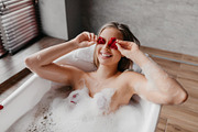 Joyful lady placing rose petals over her eyes, enjoying foamy bath and having f, a Photo by Prostock-Studio (Thumbnail 1 of 3)