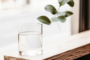 Glass of water on wooden windowsill, a Photo by Dvoevnore photos