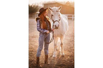 Woman farmer works with horses stock photo containing woman and ranch, a Person Photo by Maksym Zaitsev