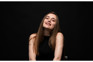 Young woman smiling with broad grin, a Person Photo by volodymyrshtun13795