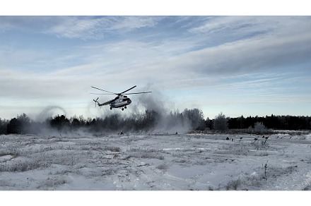 Helicopter landing on a snowy field, a Transportation Photo by Media Whale Stock