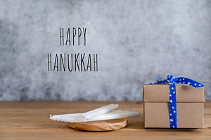 Happy hanukkah containing father, present, and brown