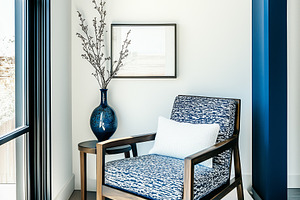 A white and blue patterned chair, an Abstract Photo by Imaginarium