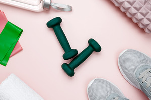 Various accessories for sports and fitness, including sneakers, dumbbells, foam, a Photo by matucha