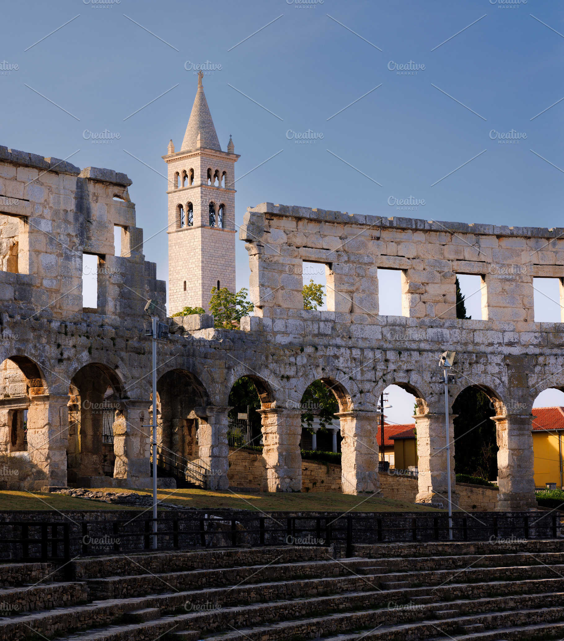 Amphitheater and bell tower of the Church of Saint Stephen, Pula, Istria, Croat, an Architecture Photo by Bepslabor