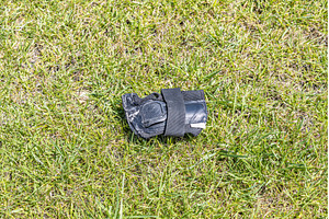 A gray wrist guard on the green, a Sports & Recreation Photo by Illustrations&photos