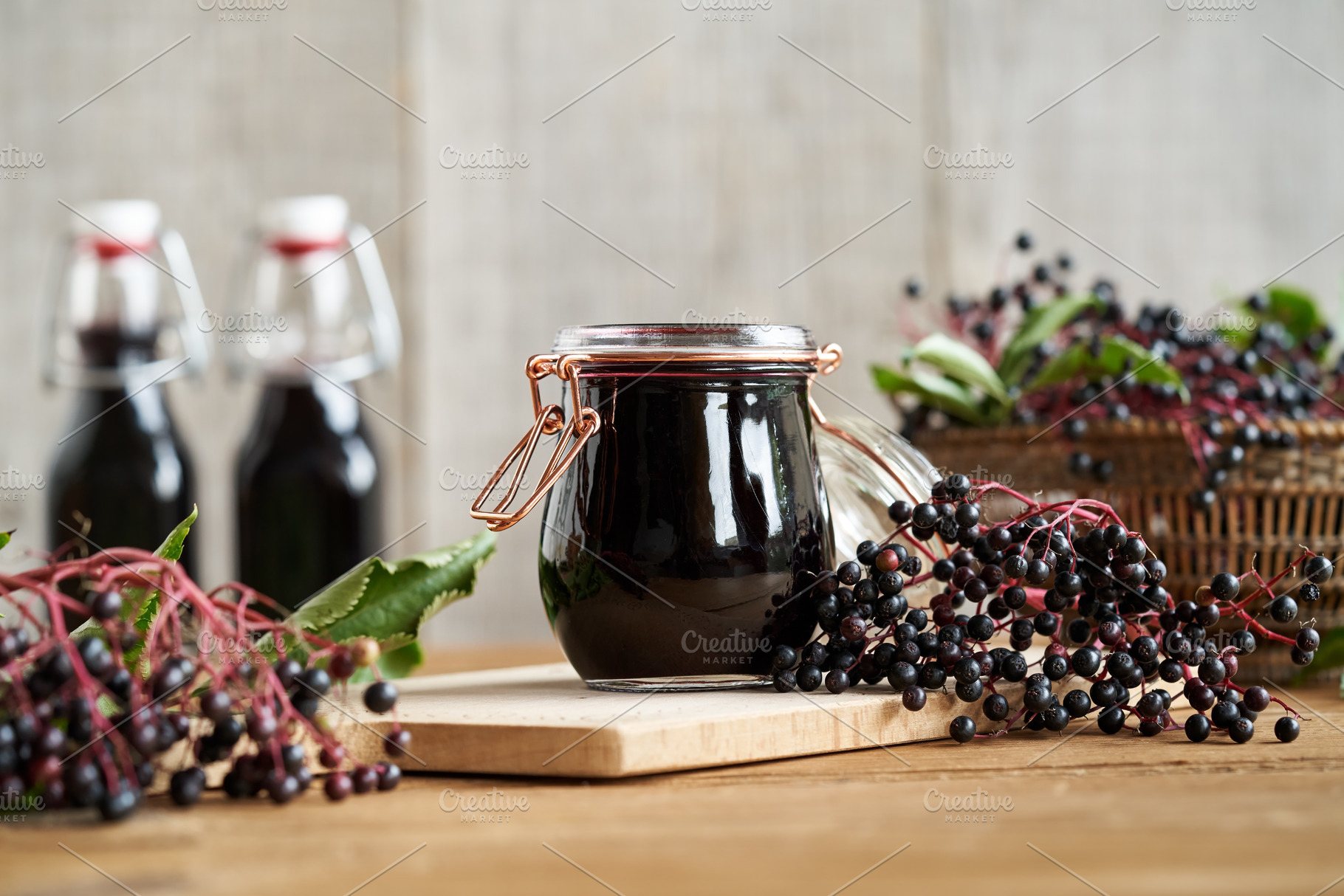 A jar of black elder syrup with fresh Sambucus nigra berries, a Food & Drink Photo by Madeleine Steinbach