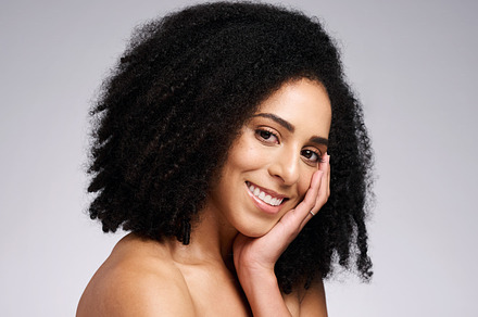 Beauty, skincare and product with portrait of black woman for facial, self care and luxury cosmetics. Spa, hair care and makeup with face of girl model for treatment, natural and wellness in studio, a Photo by Peopleimages.com