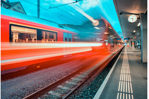 Blurred red passenger train passing, a Transportation Photo by den-belitsky