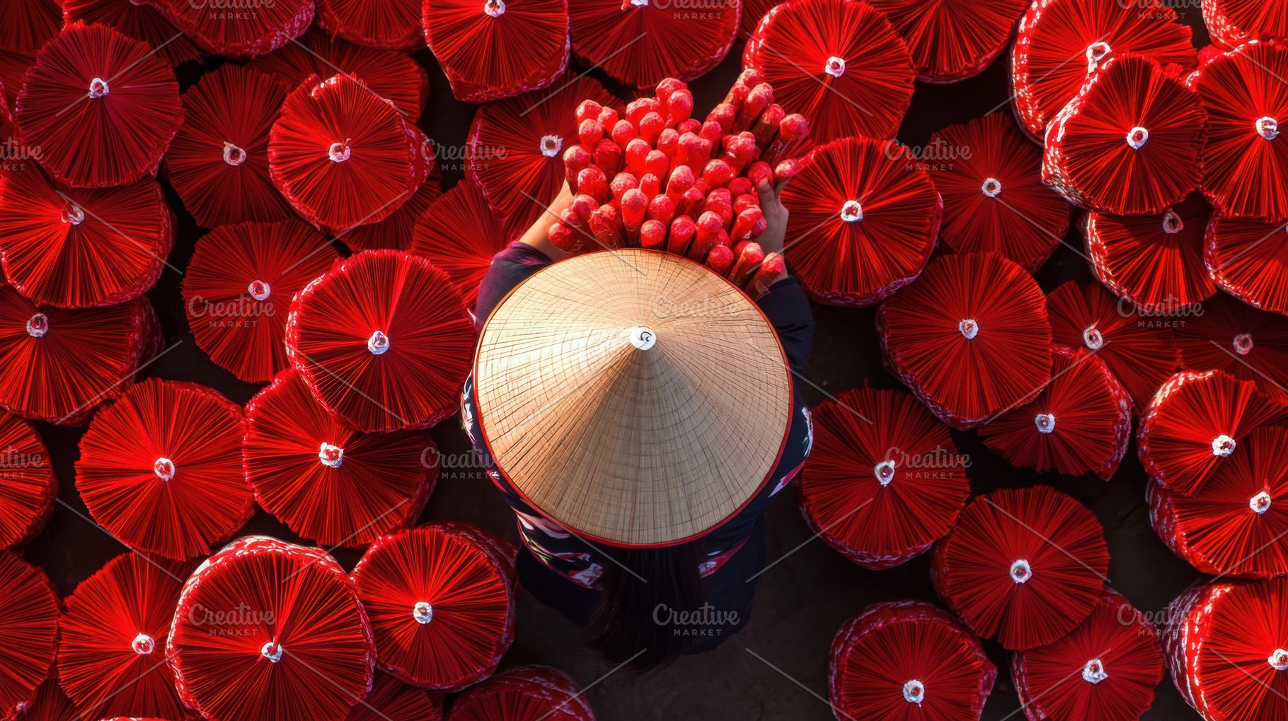 Making red umbrellas in Vietnam, a Photo by Beautiful things