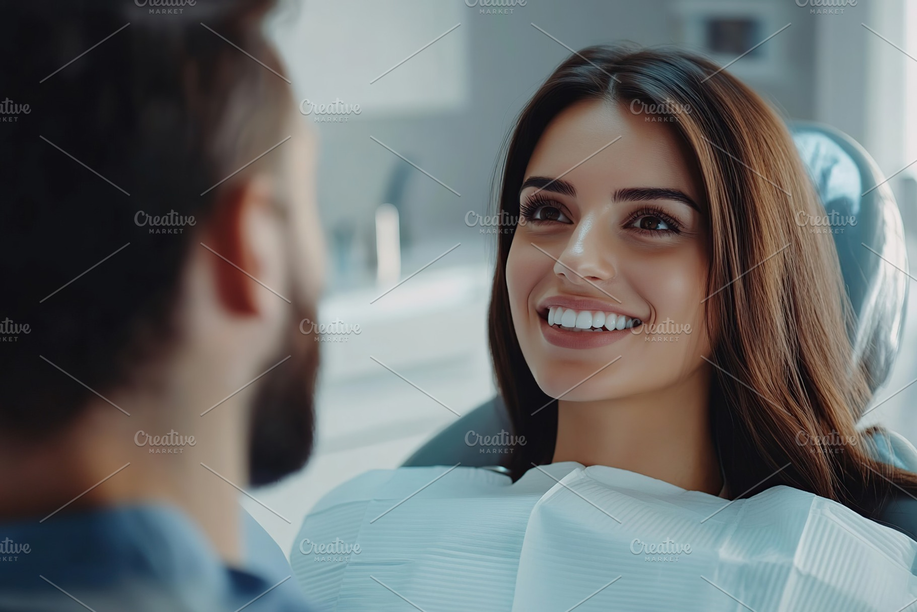 Photo of young woman sitting in a dental chair and male dentist treating her te, a Health & Medical Photo by AlyaAnd