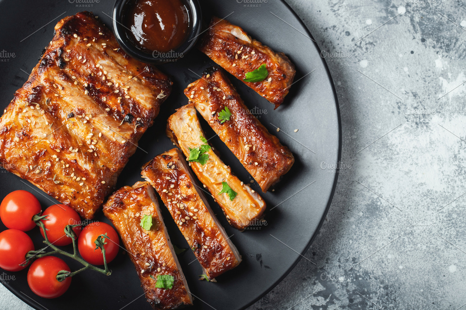 Closeup of pork ribs grilled with BBQ sauce and caramelized in honey., a Food & Drink Photo by Budarinphoto