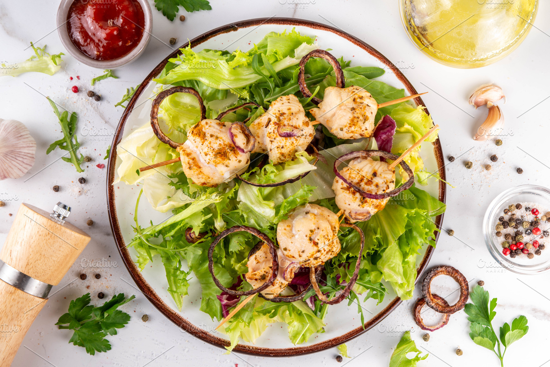 Chicken kebab skewers with fresh vegetable salad, a Food & Drink Photo by Rimma