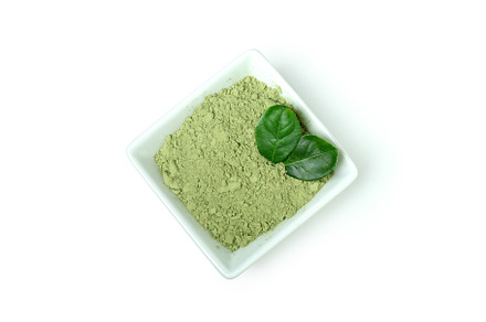 Matcha green powder isolated on white background, a Food & Drink Photo by AtlasStudio