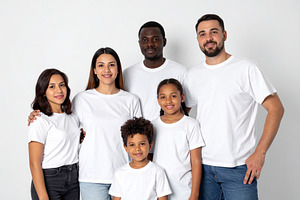 Diverse family standing together against a plain white backgroun, a Person Photo by DanFLCreativo