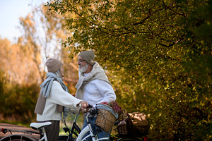 Senior couple standing with bicycles, a Sports & Recreation Photo by HalfPoint