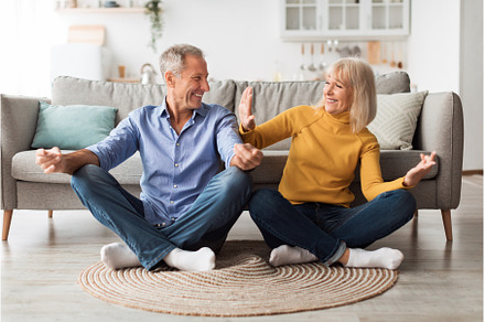 Mature Couple Doing Yoga Sitting In, a Person Photo by Prostock-Studio