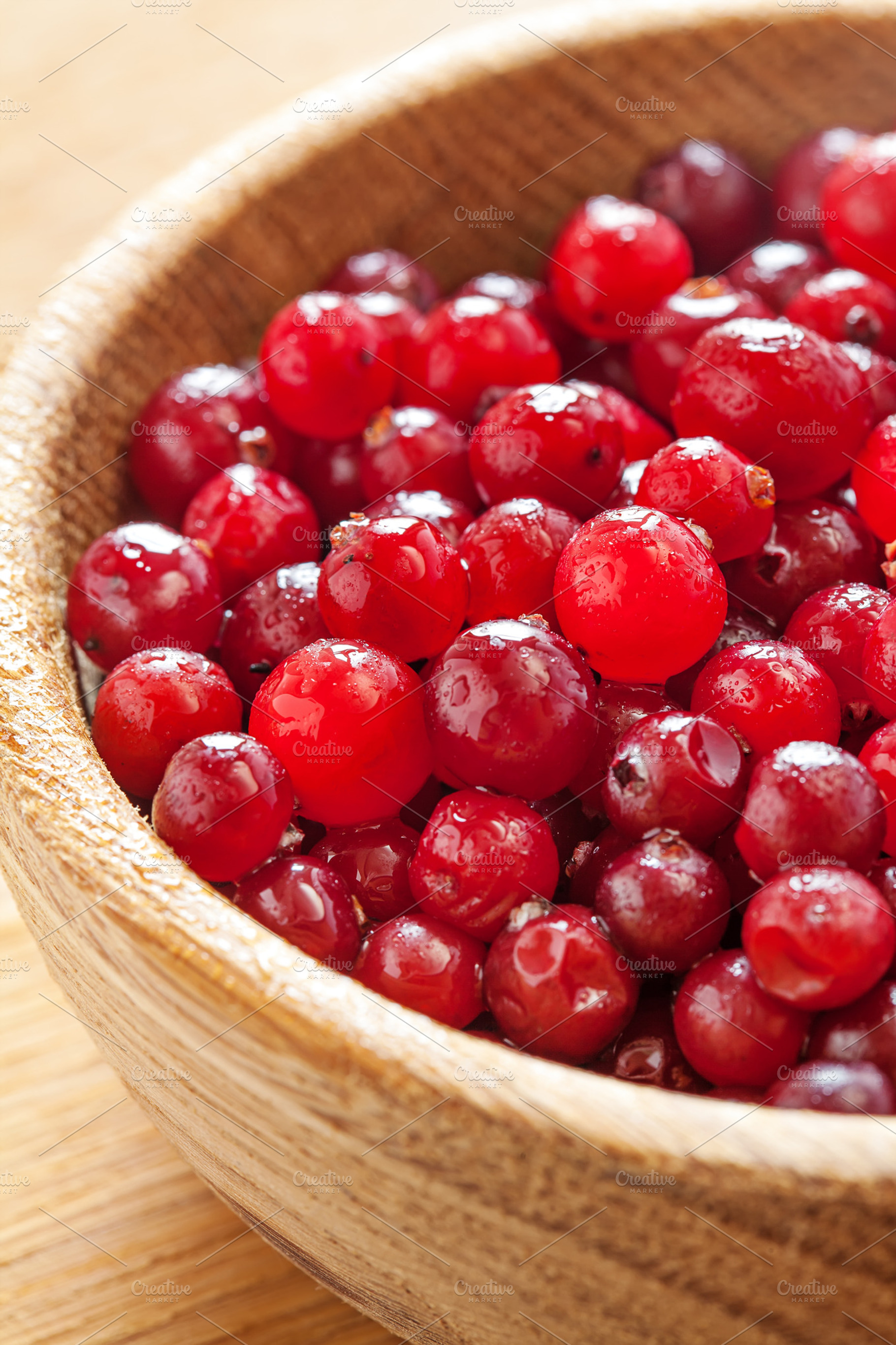 Red Cranberries In Wooden Dish