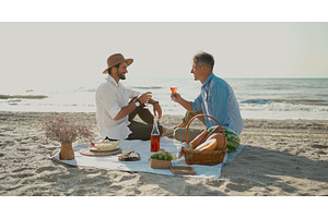 European happy gay couple drinking